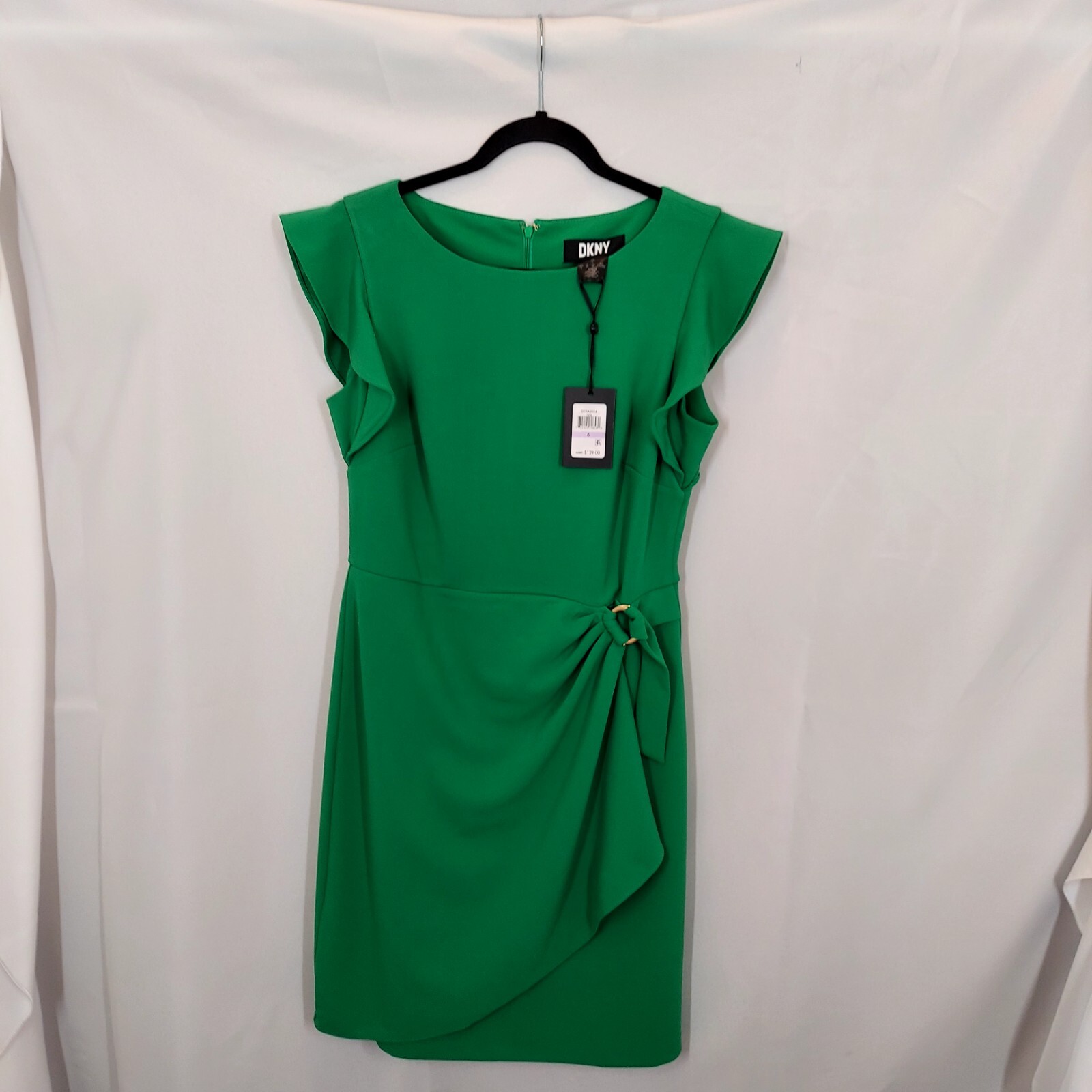 Women DKNY green dress. Size 6 new with tags zip closure blended.Blended fabric