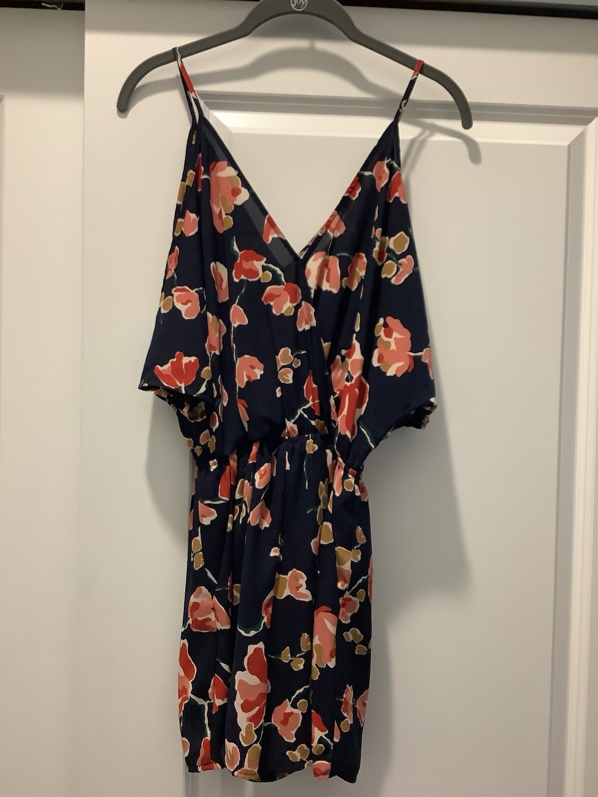 ASTR SUN ROMPER, FLORAL PRINT ON NAVY BACKGROUND, CAN BE WORN CASUAL OR DRESSY.