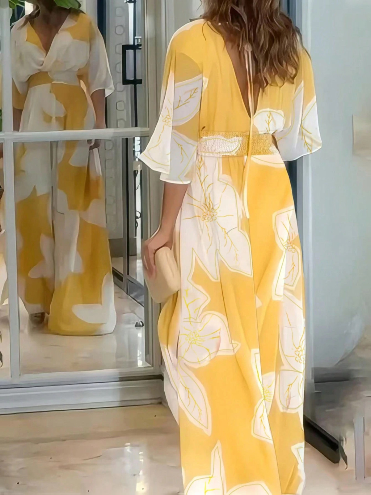 Elegant long dress with all over pattern in yellow