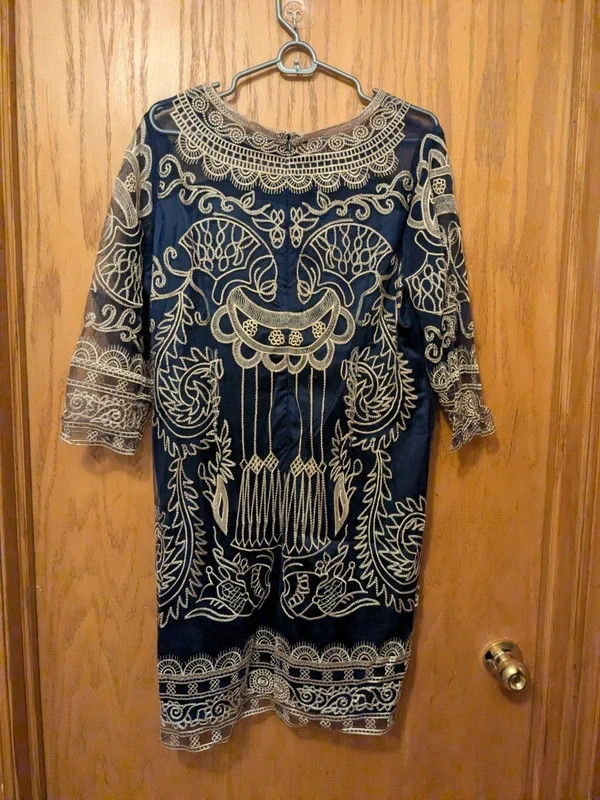 A lightweight sheer navy blue shift/sheath dress
