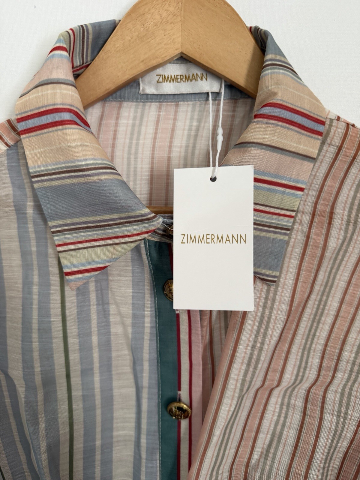 Brand tag present. Care labels missing. Authenticity not verified.