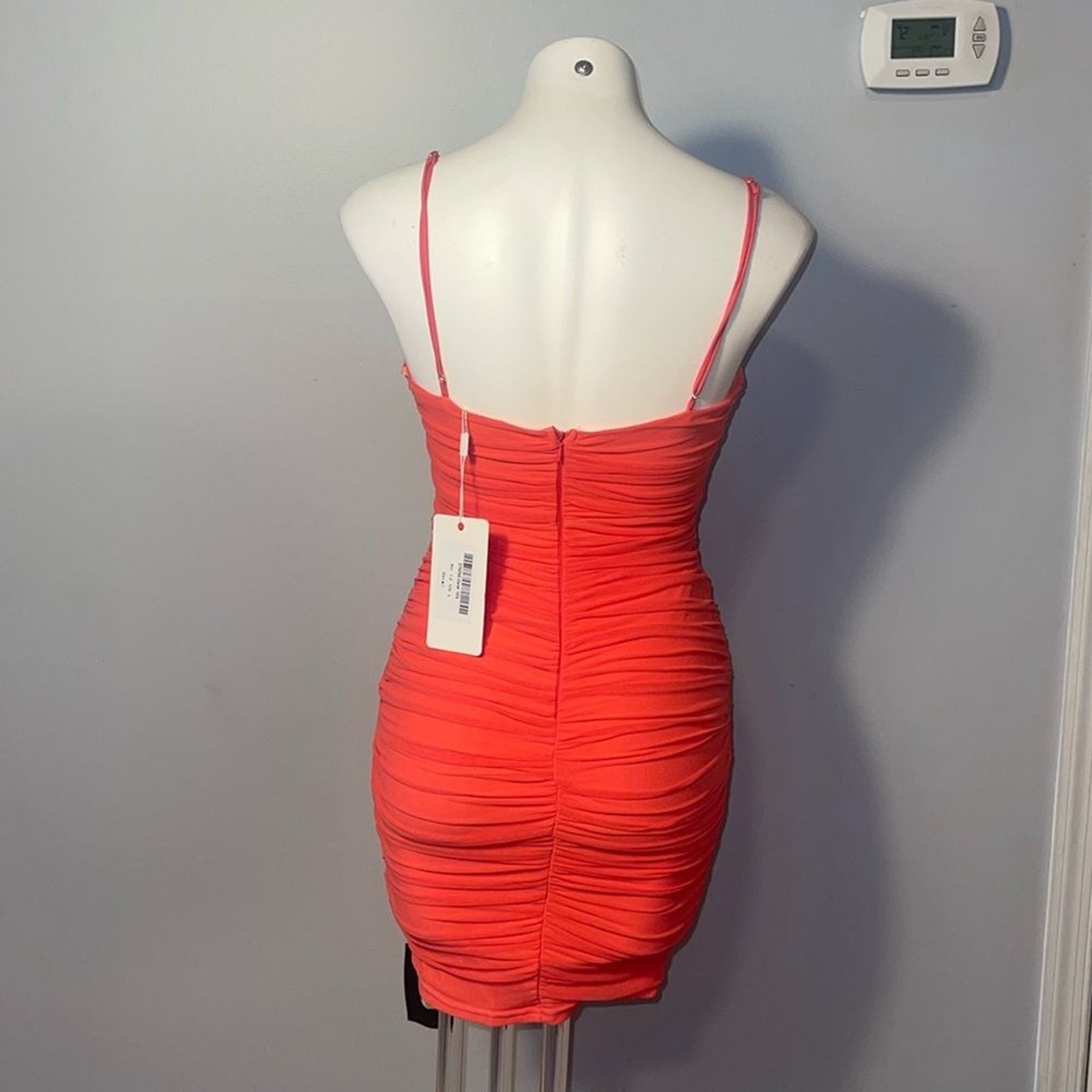 Saints + Secrets ladies Coral Ruched Mini Dress. Size large.