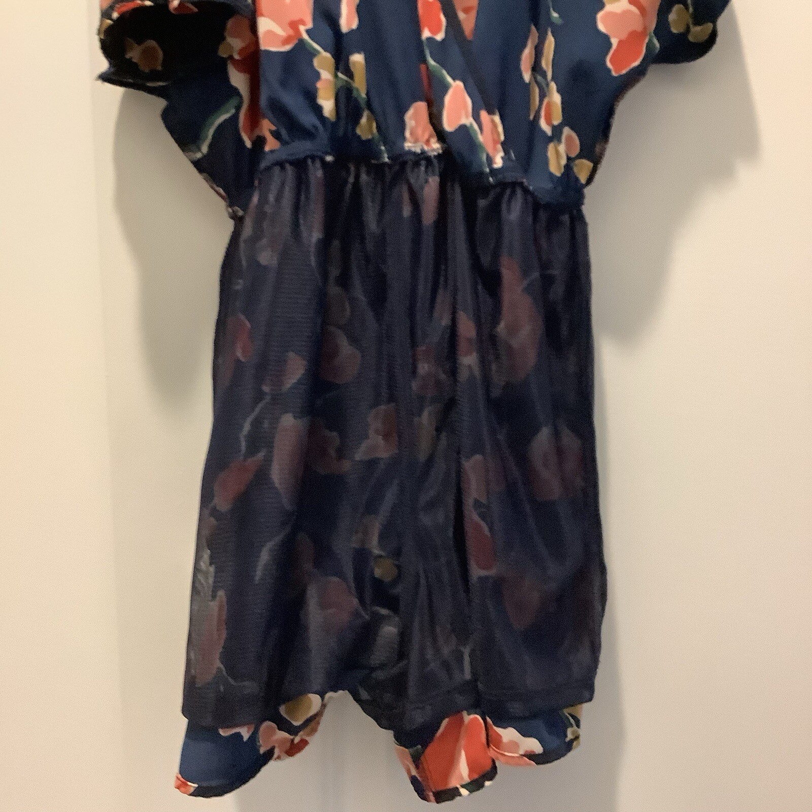 ASTR SUN ROMPER, FLORAL PRINT ON NAVY BACKGROUND, CAN BE WORN CASUAL OR DRESSY.