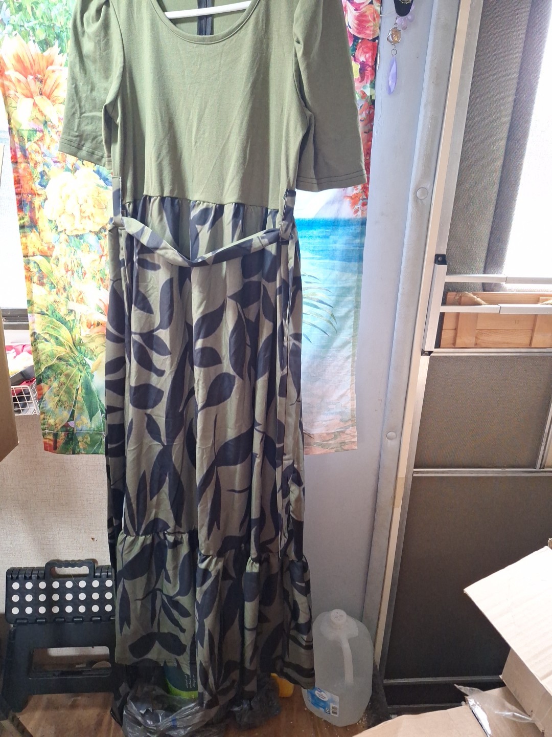 A Short Sleeved Maxi Dress With A Top in Solid Green And The Bottom Camouflage
