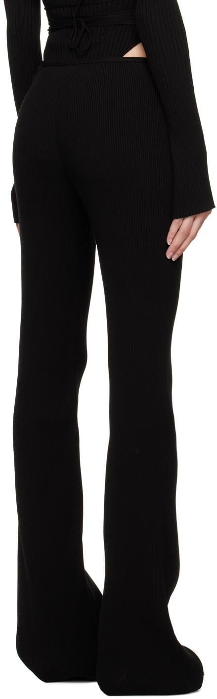 MACH&MACH Black Bow Trousers knit trousers. Cutout and crystal bow accent Size S