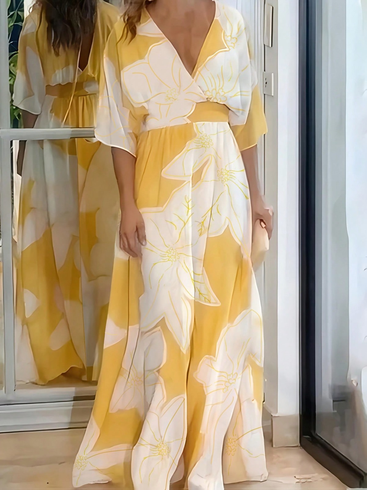 Elegant long dress with all over pattern in yellow