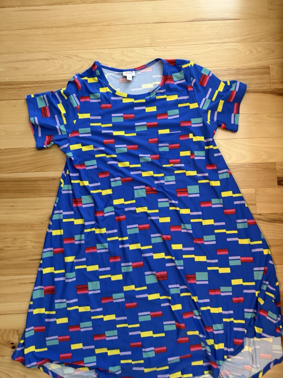 LuLaRoe Carly swing dress featuring a vibrant, multi-colored geometric block XL
