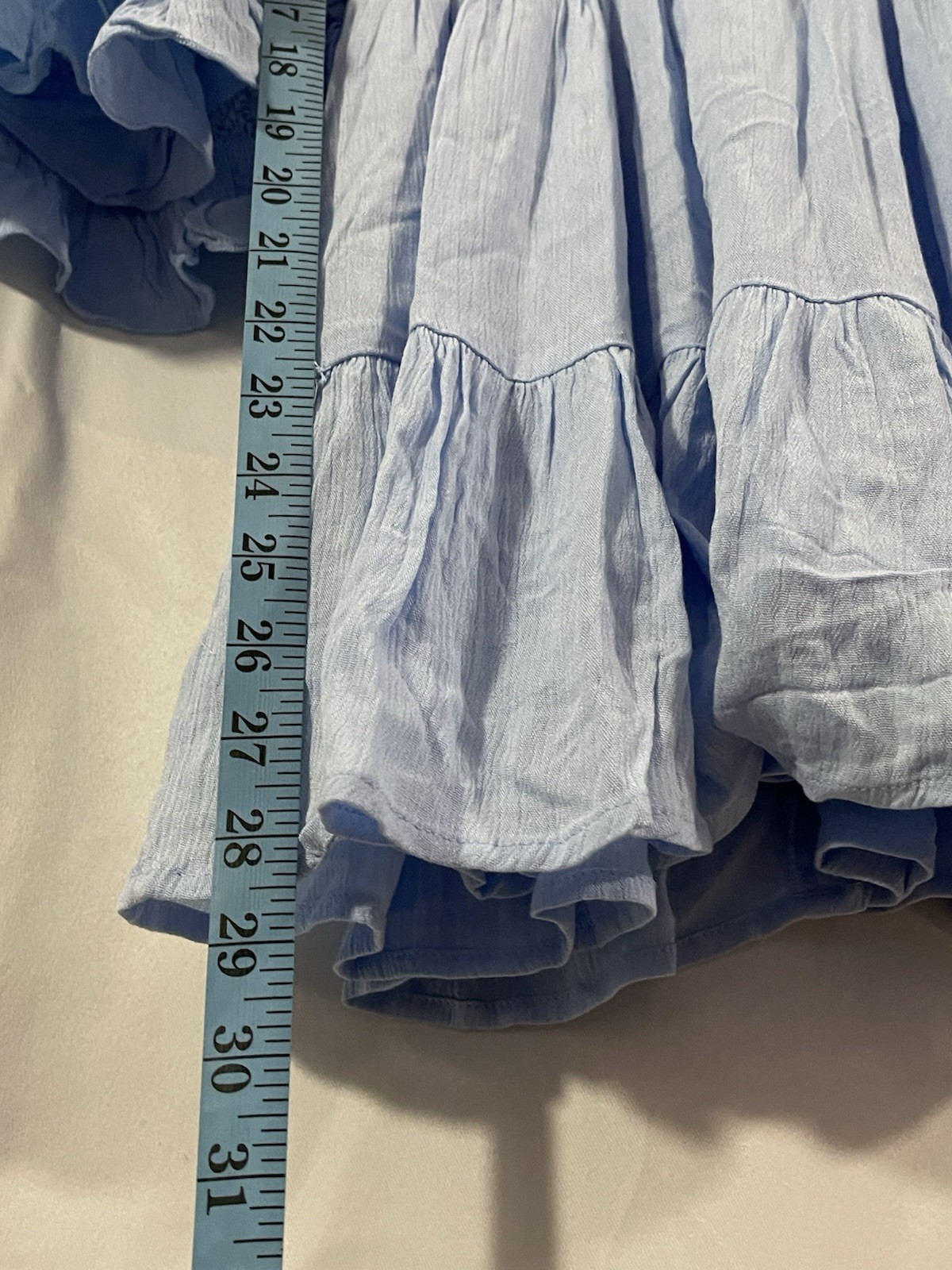 2 women’s dresses: one light blue Shero (size S, wide sleeves) and one white