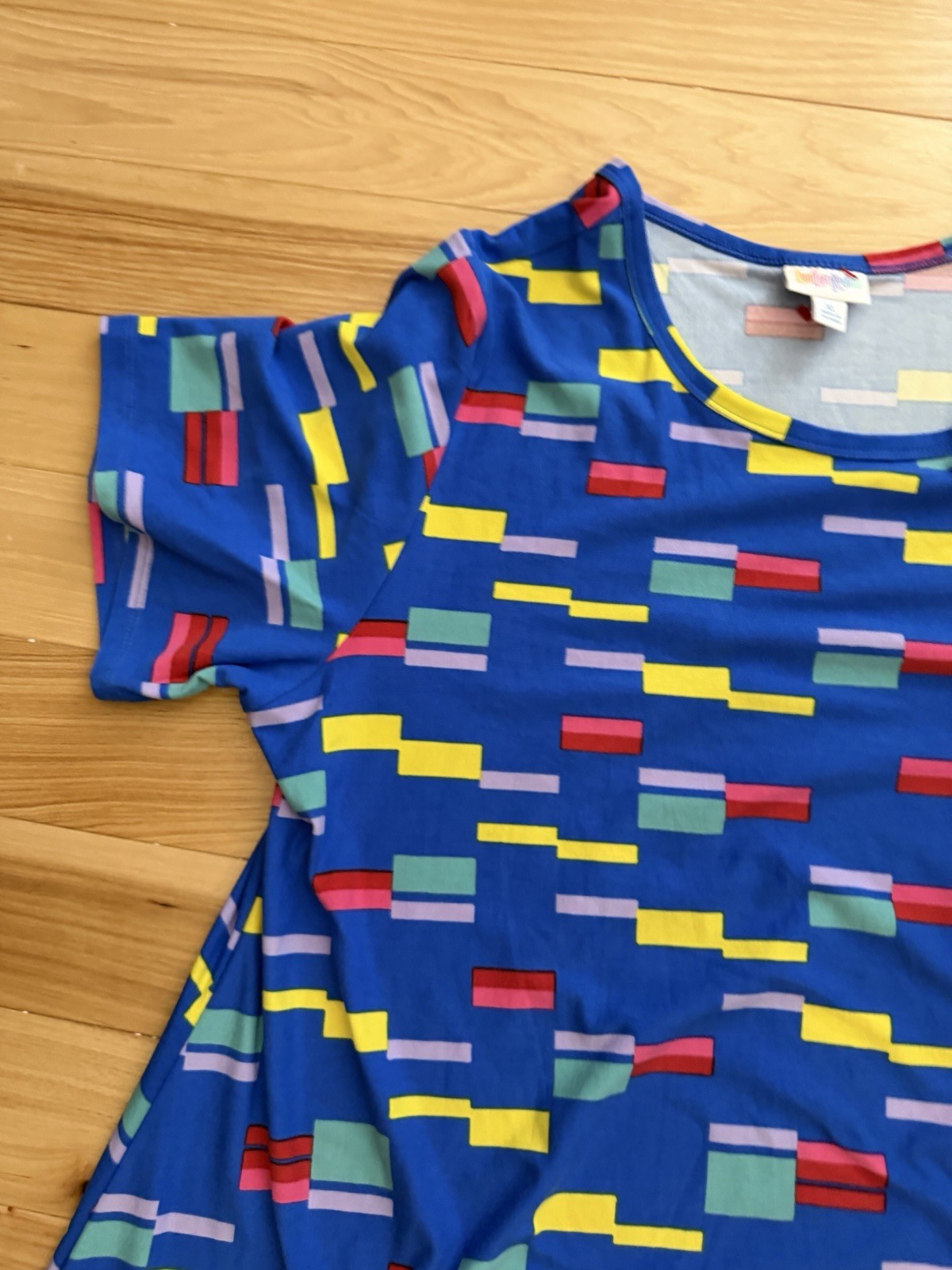 LuLaRoe Carly swing dress featuring a vibrant, multi-colored geometric block XL