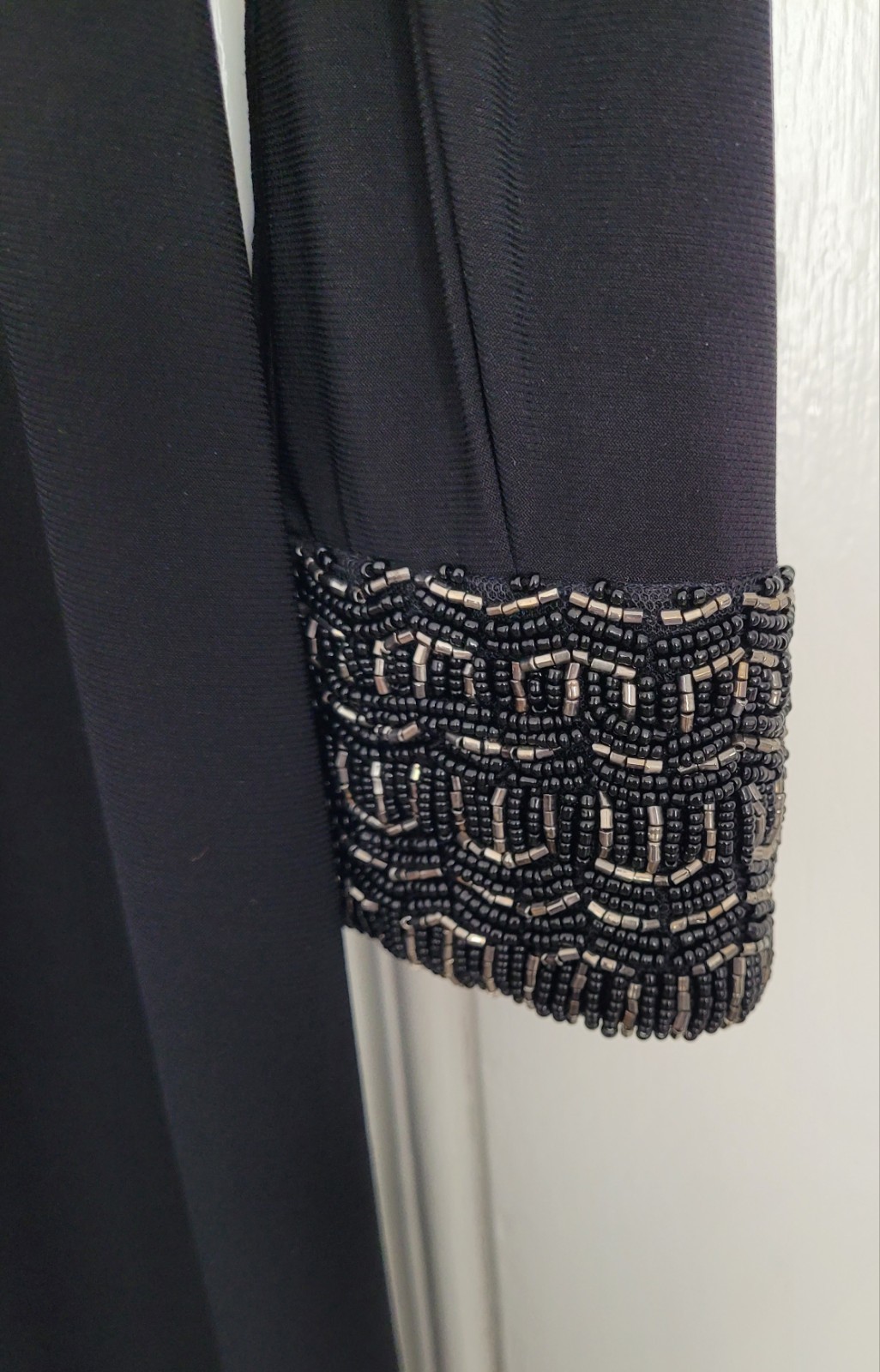 Long black long-sleeved Ariella evening dress fully lined beaded cuff size 14