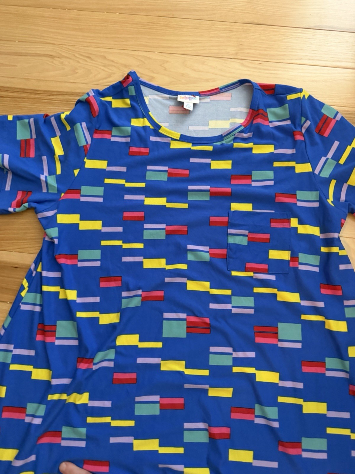 LuLaRoe Carly swing dress featuring a vibrant, multi-colored geometric block XL