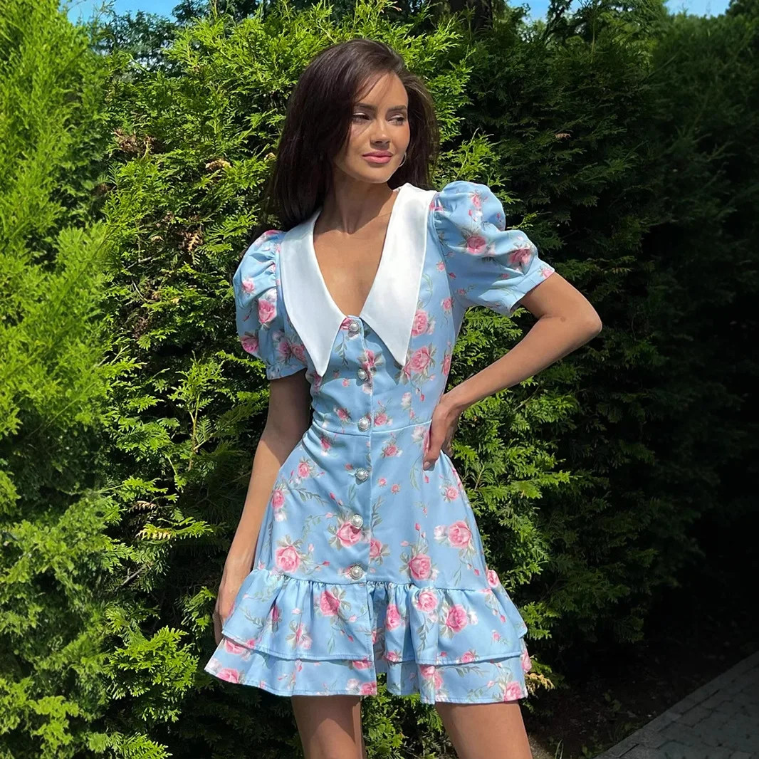 A lightweight, luxurious chiffon dress with a V-neck and puff sleeves.