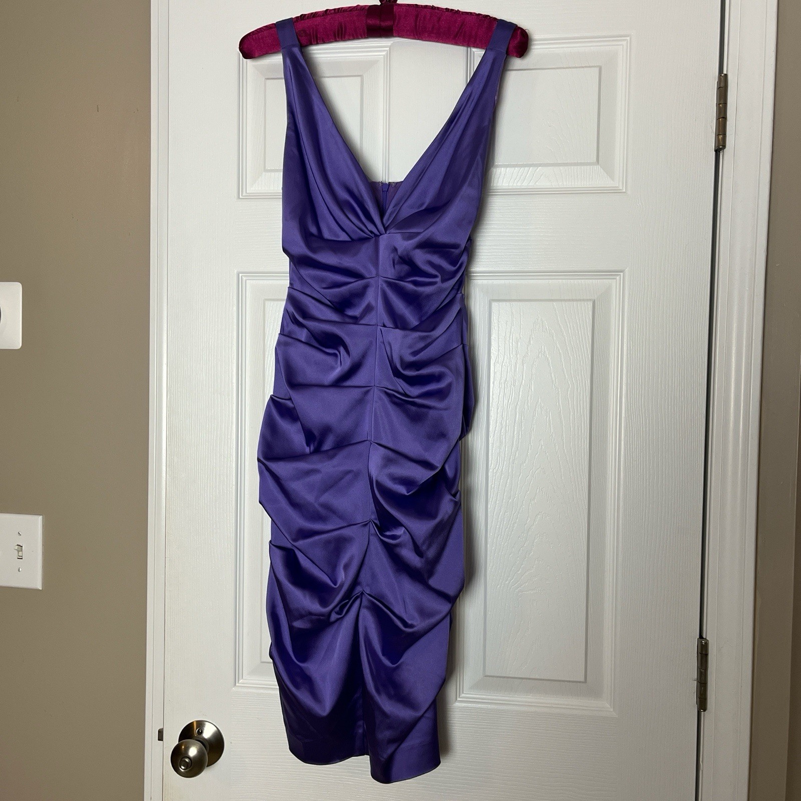 NWOT Issue NY purple dress made of an acetate/nylon/spandex blend shell. Size 4