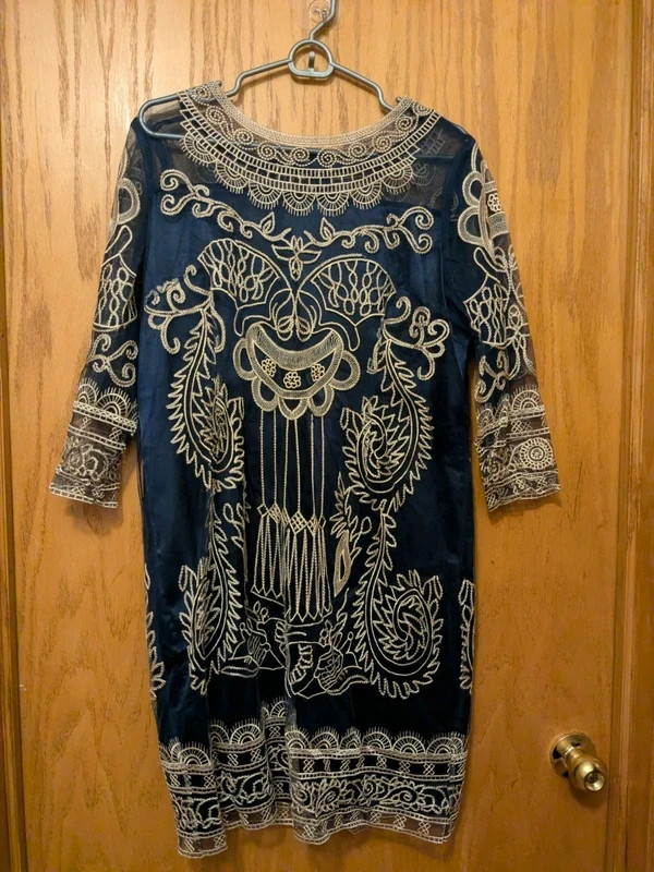 A lightweight sheer navy blue shift/sheath dress