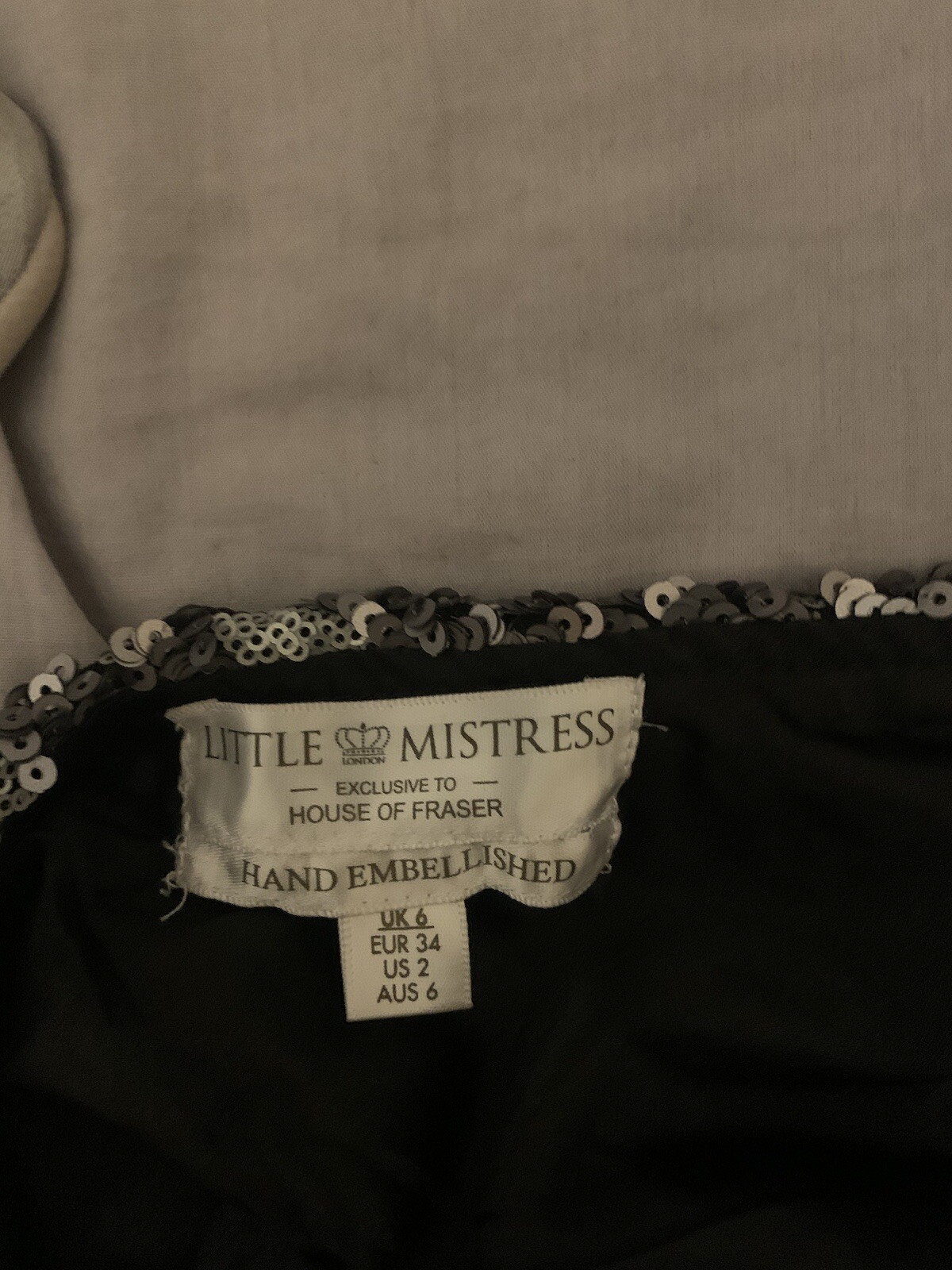Little Mistress Maxi Dress with hand embellished silver sequins. low cut back.