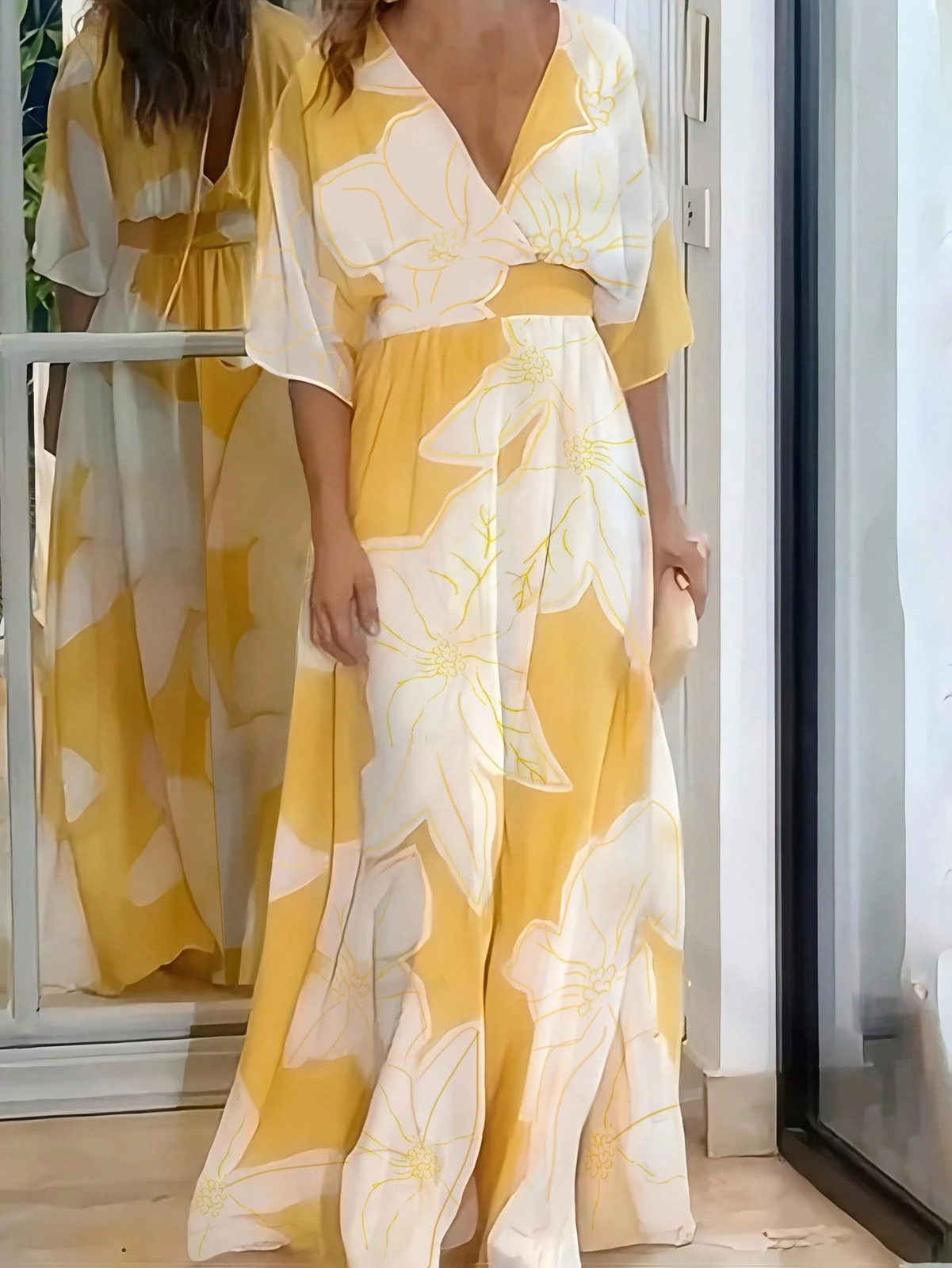 Elegant long dress with all over pattern in yellow