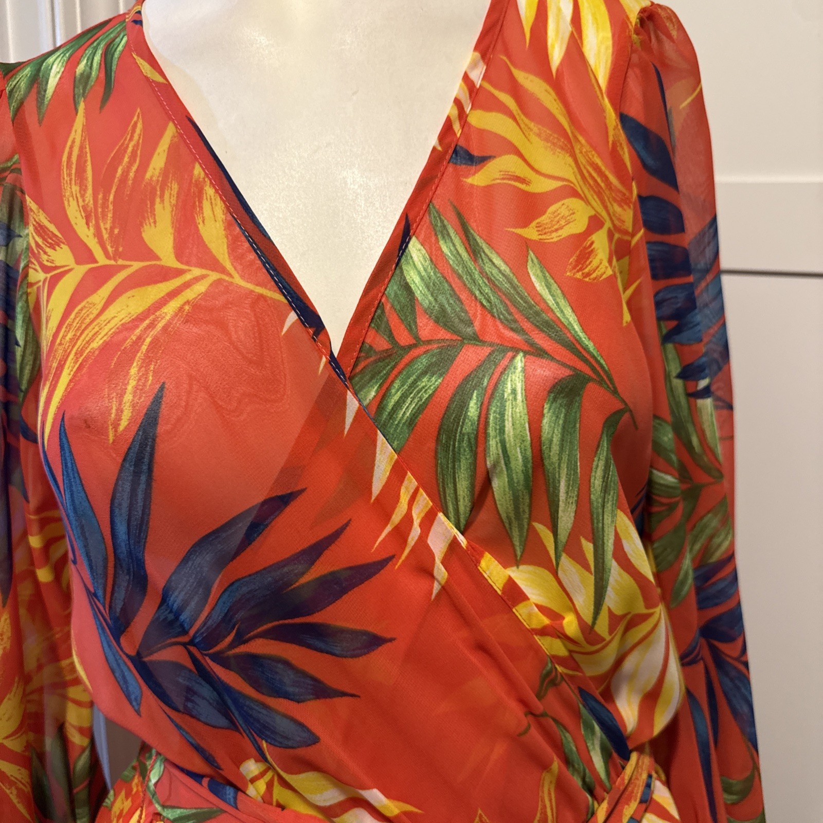 Vava Voom orange dress features a vibrant tropical print and bishop style sleev