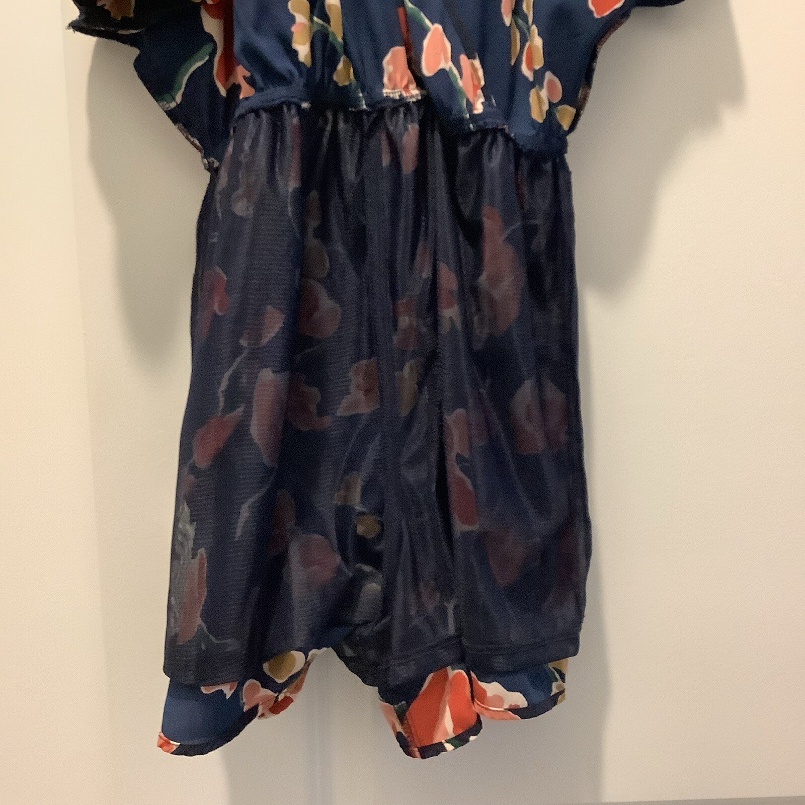 ASTR SUN ROMPER, FLORAL PRINT ON NAVY BACKGROUND, CAN BE WORN CASUAL OR DRESSY.