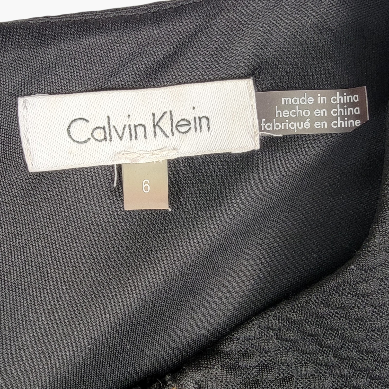Calvin Klein Black Sheath Dress with Textured Fabric and Gold Zipper Accents