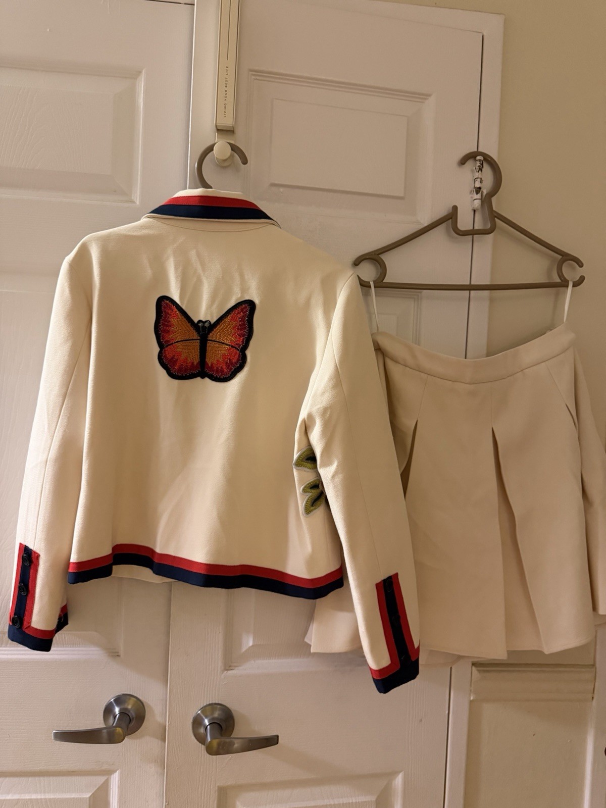Cream Floral Embroidered Two-Piece Jacket & Skirt Set with Red-Blue Trim