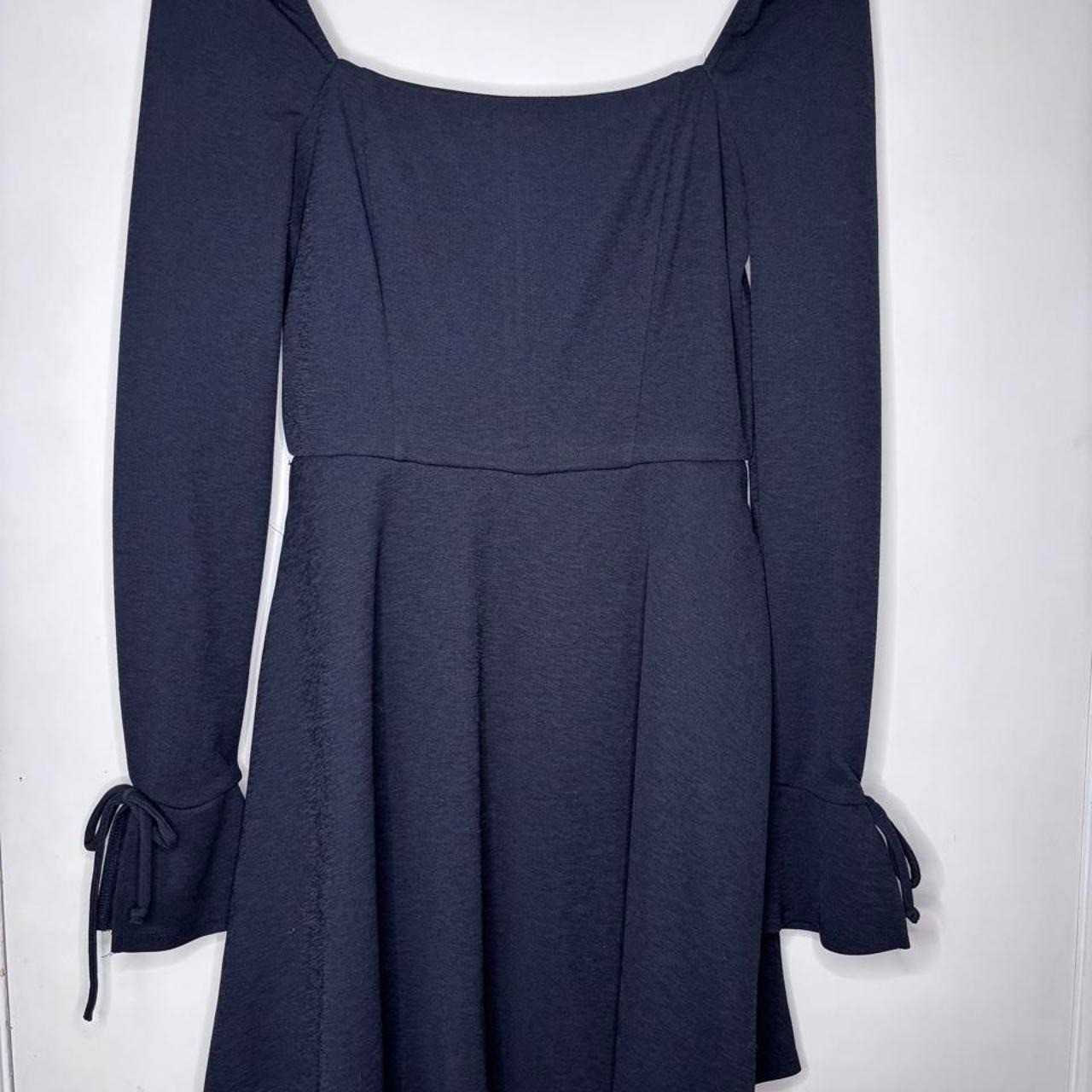 Black long sleeve dress with tie detail on sleeves. Small