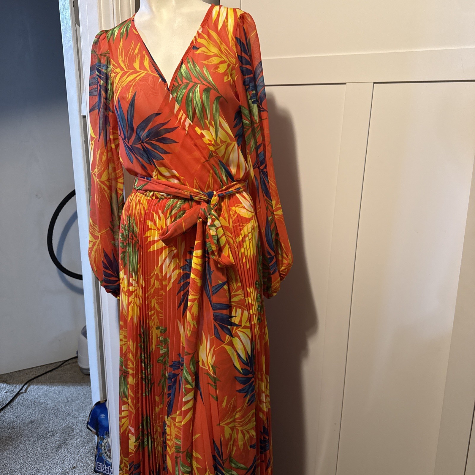 Vava Voom orange dress features a vibrant tropical print and bishop style sleev