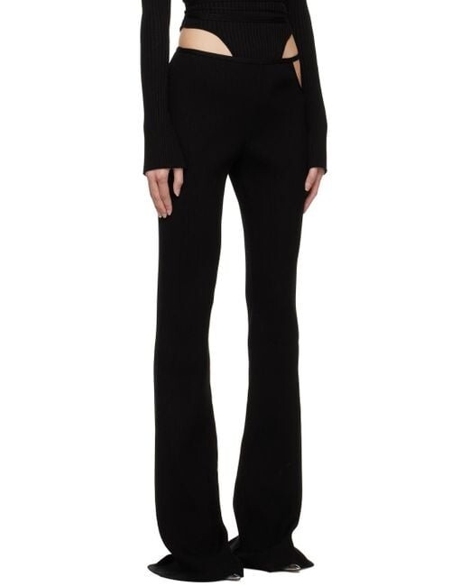 MACH&MACH Black Bow Trousers knit trousers. Cutout and crystal bow accent Size S
