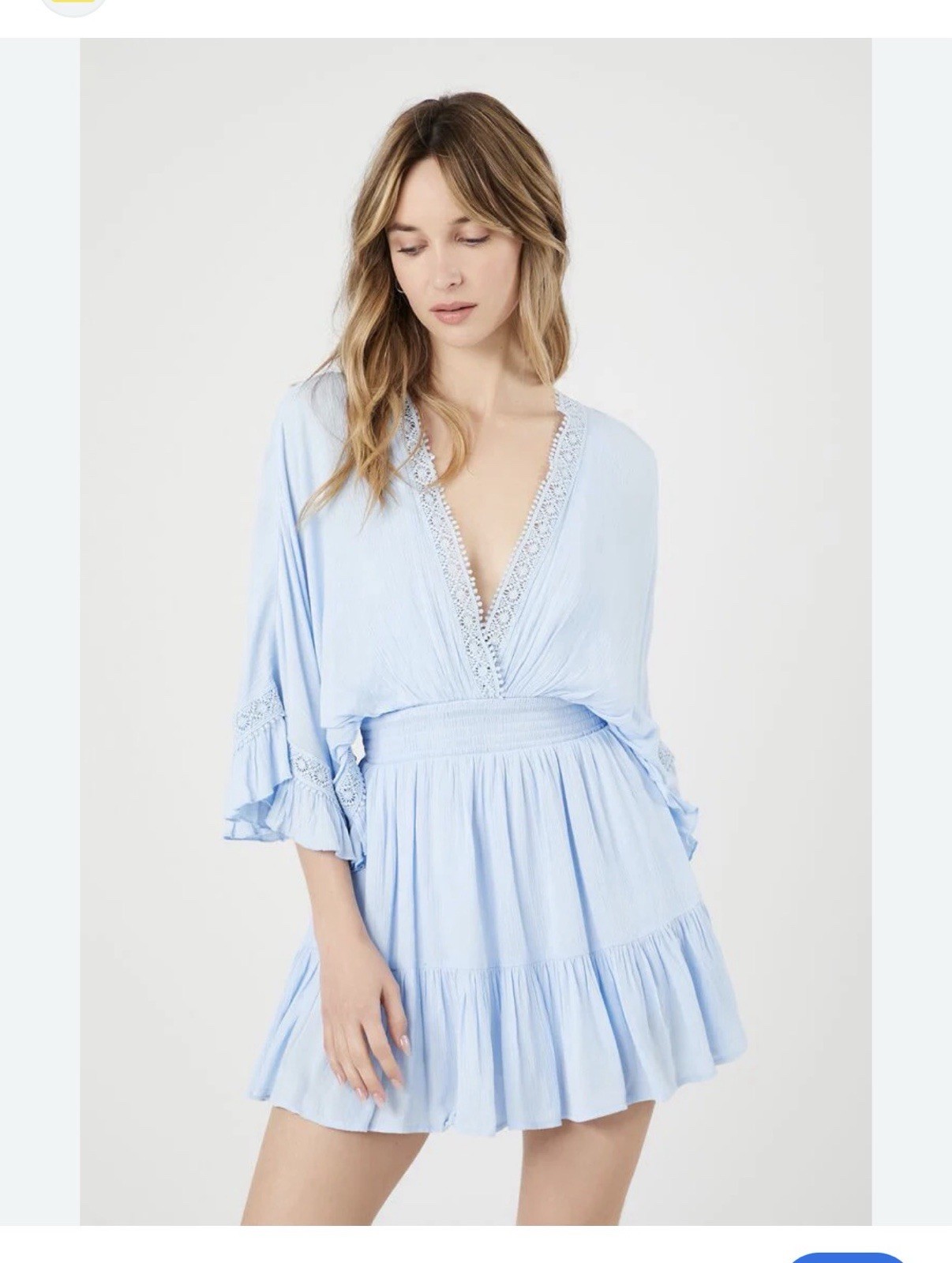 2 women’s dresses: one light blue Shero (size S, wide sleeves) and one white