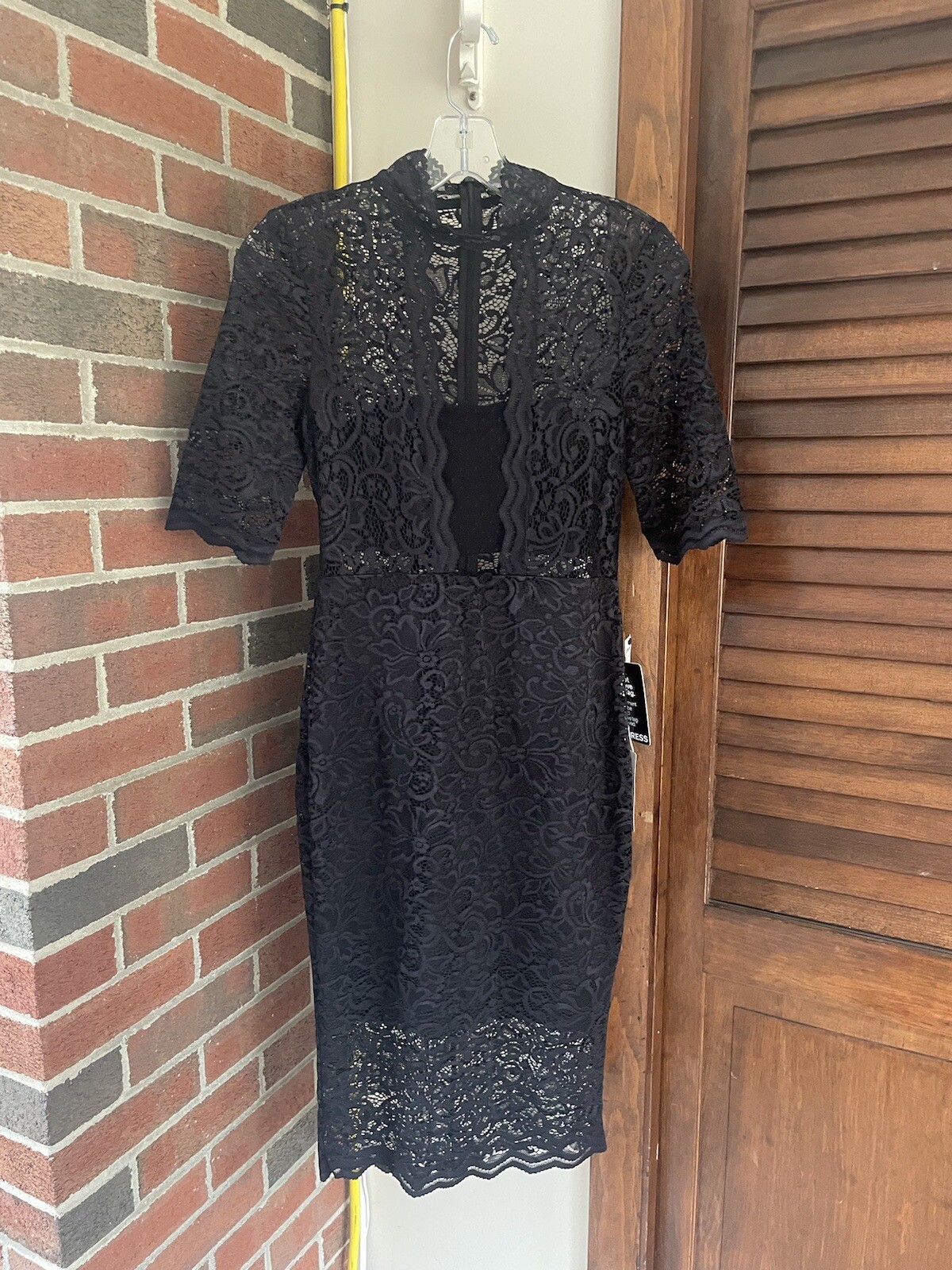 Express women’s black lace dress size 4, half sleeve, back zip and high neck