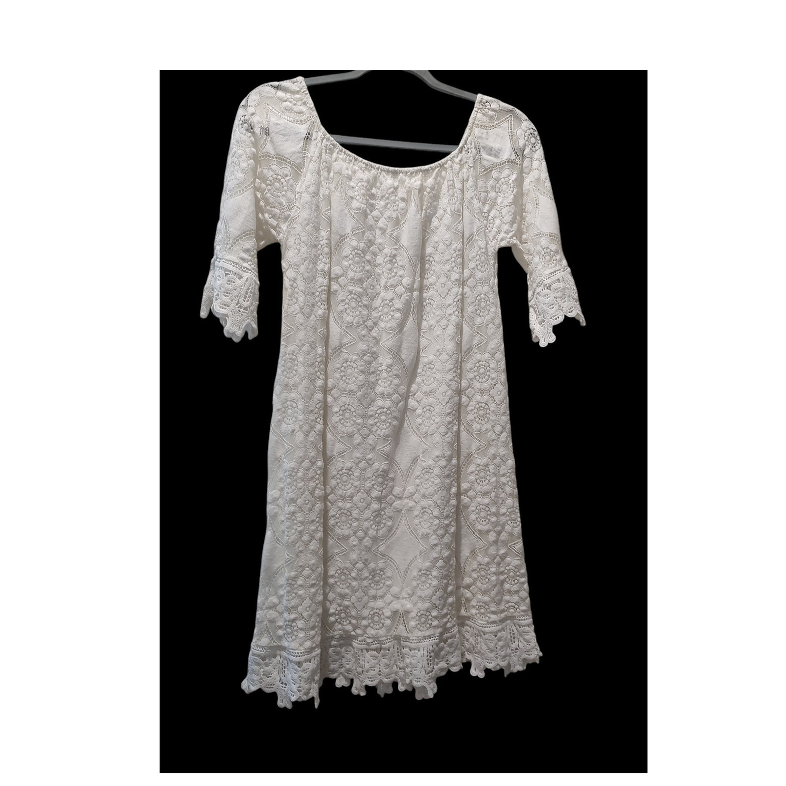Straight from Italy is this gorgeous lace , lined dress.