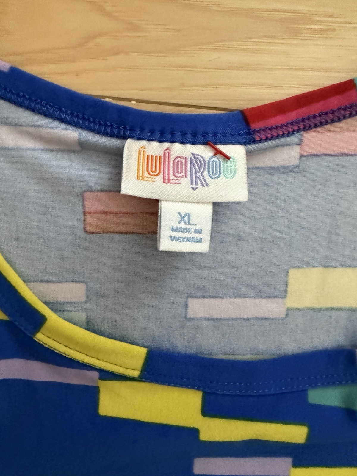 LuLaRoe Carly swing dress featuring a vibrant, multi-colored geometric block XL