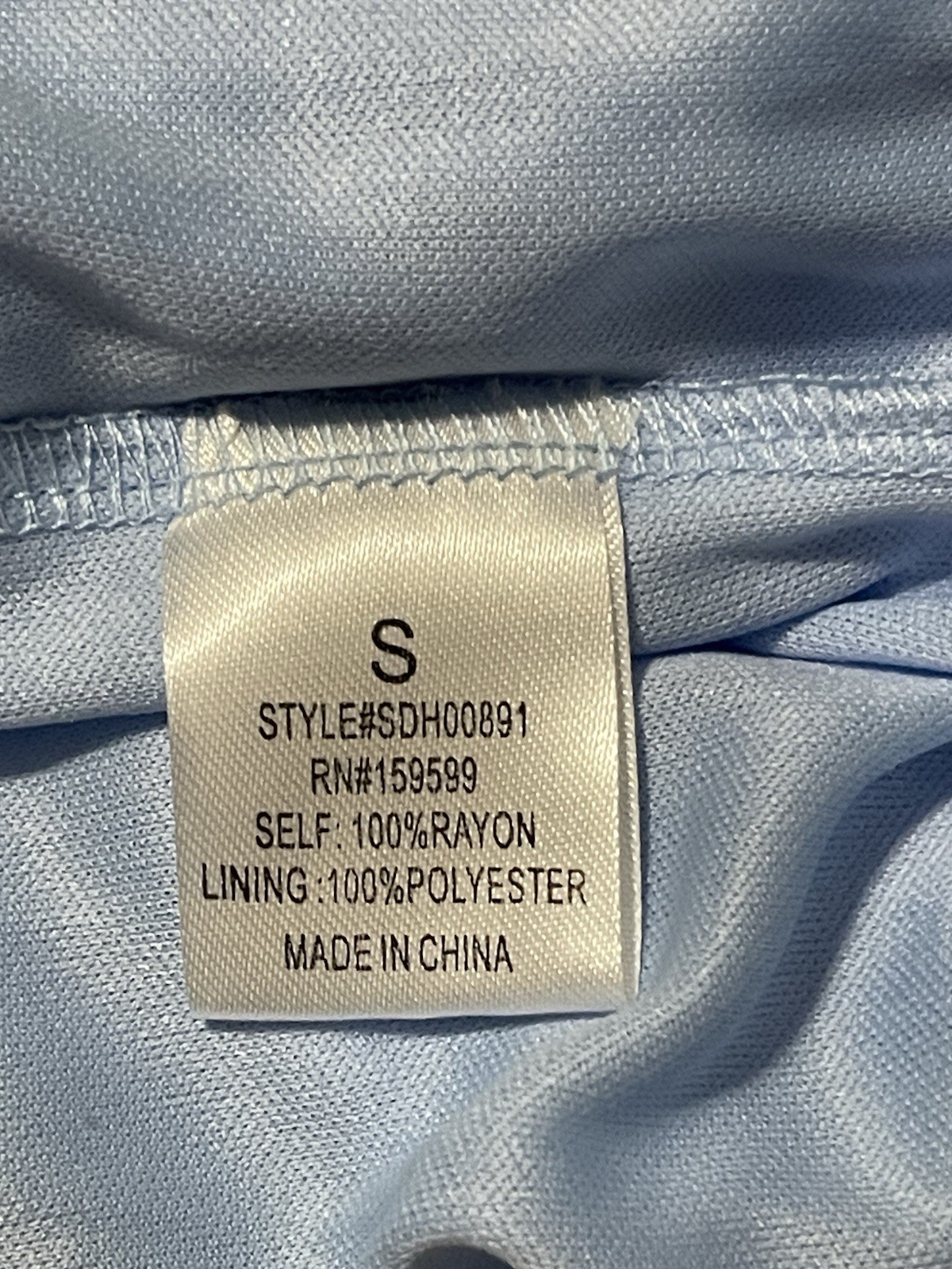 2 women’s dresses: one light blue Shero (size S, wide sleeves) and one white