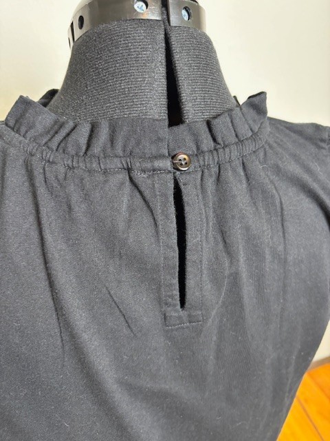 Solid black Caslon dress large cotton with button back closure, ruffled skirt
