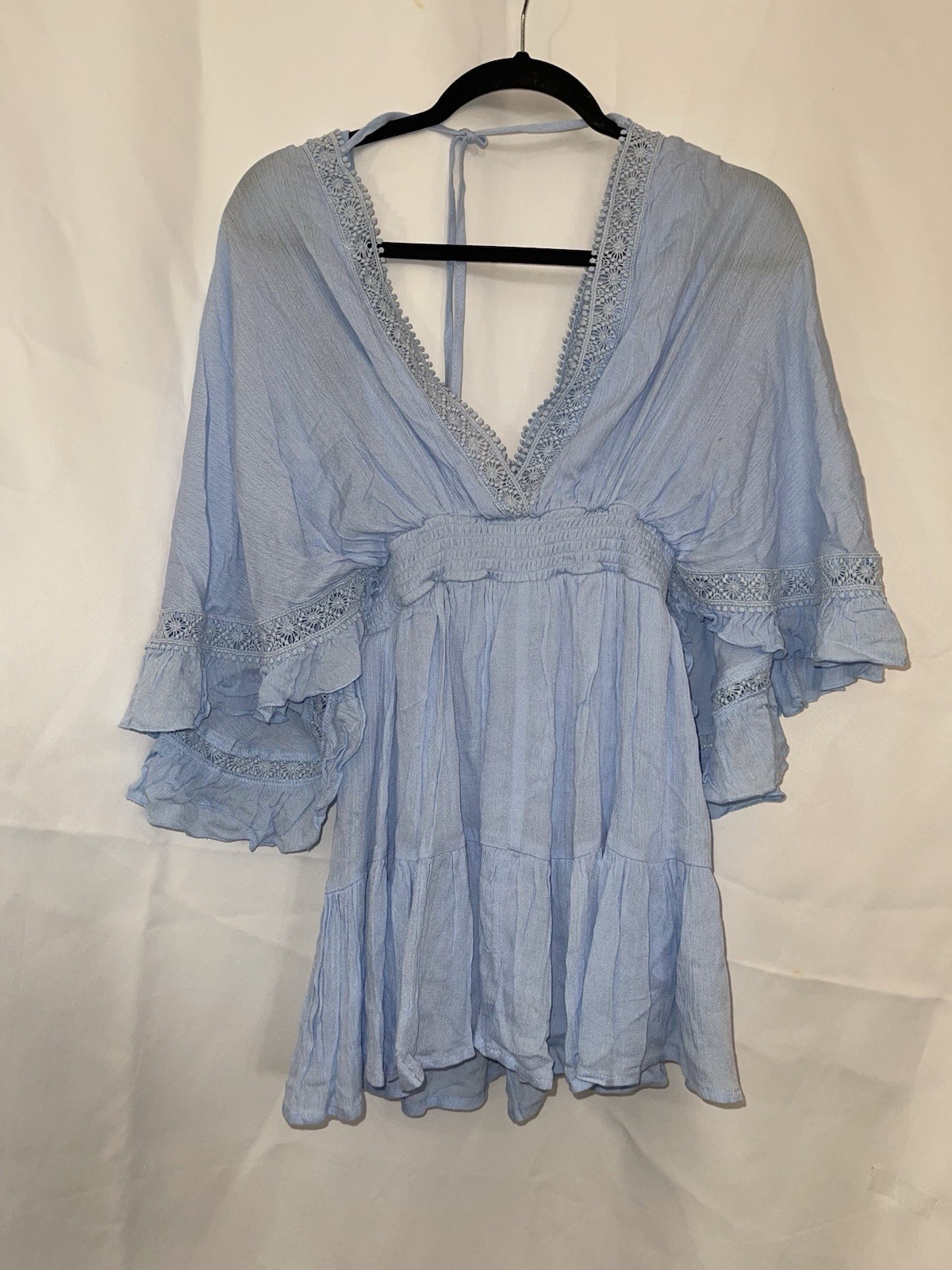 2 women’s dresses: one light blue Shero (size S, wide sleeves) and one white