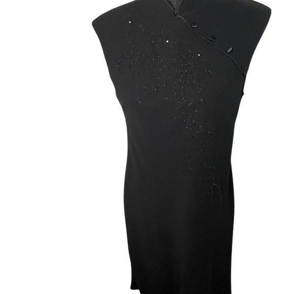 Black beaded dress detailed bead design and high neck collar. Size 10.