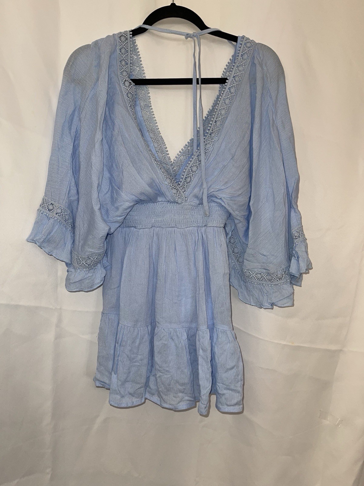 2 women’s dresses: one light blue Shero (size S, wide sleeves) and one white