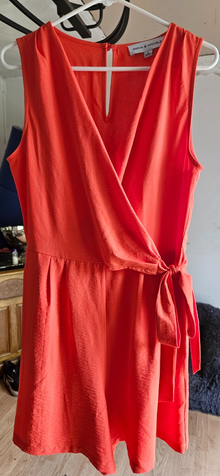 Orange jumpsuit, shorts with pockets. Size Medium, worn about an hour.