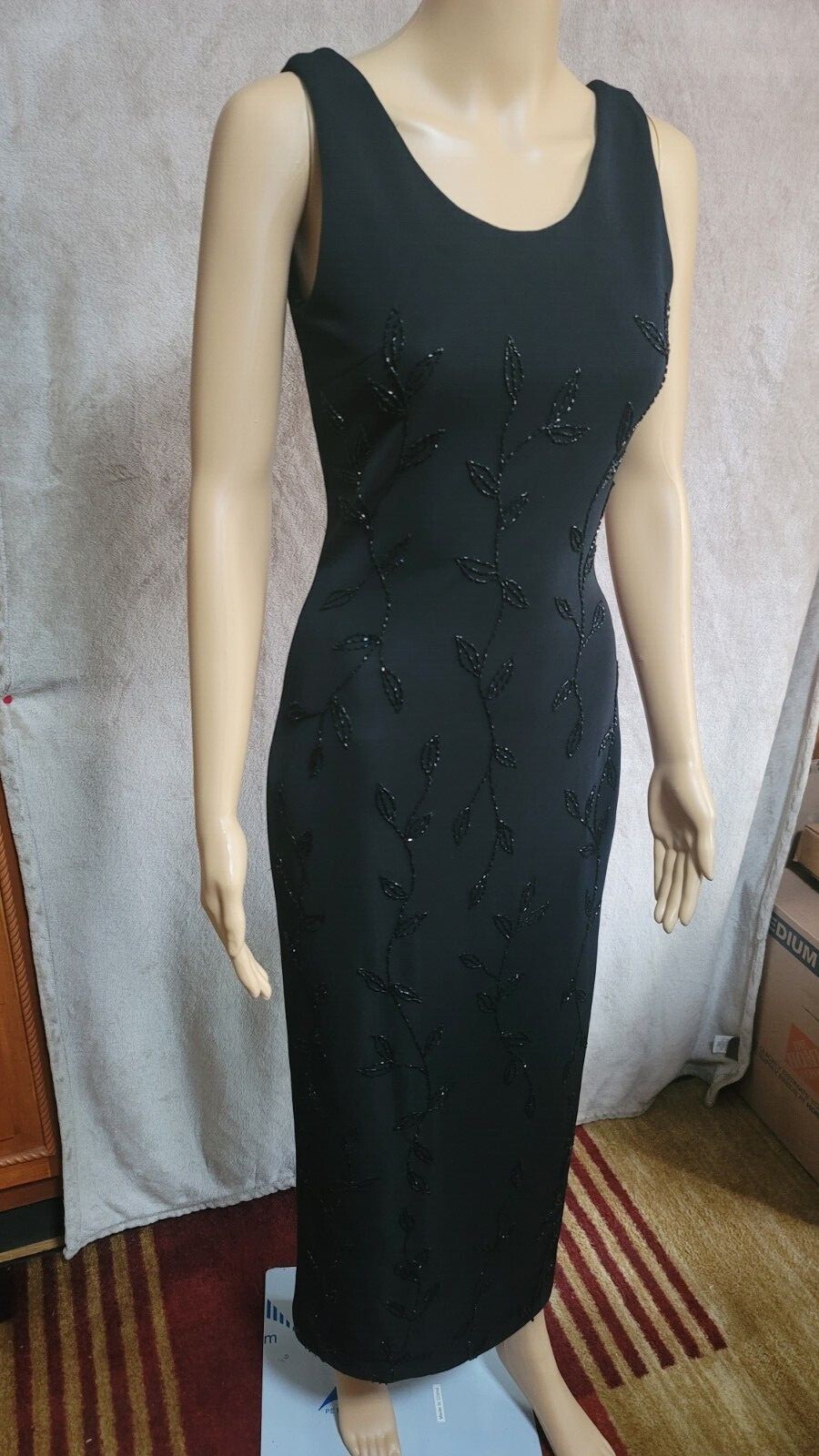 This is a gorgeous Jovani dress (style 81120). The color is mate black decorated