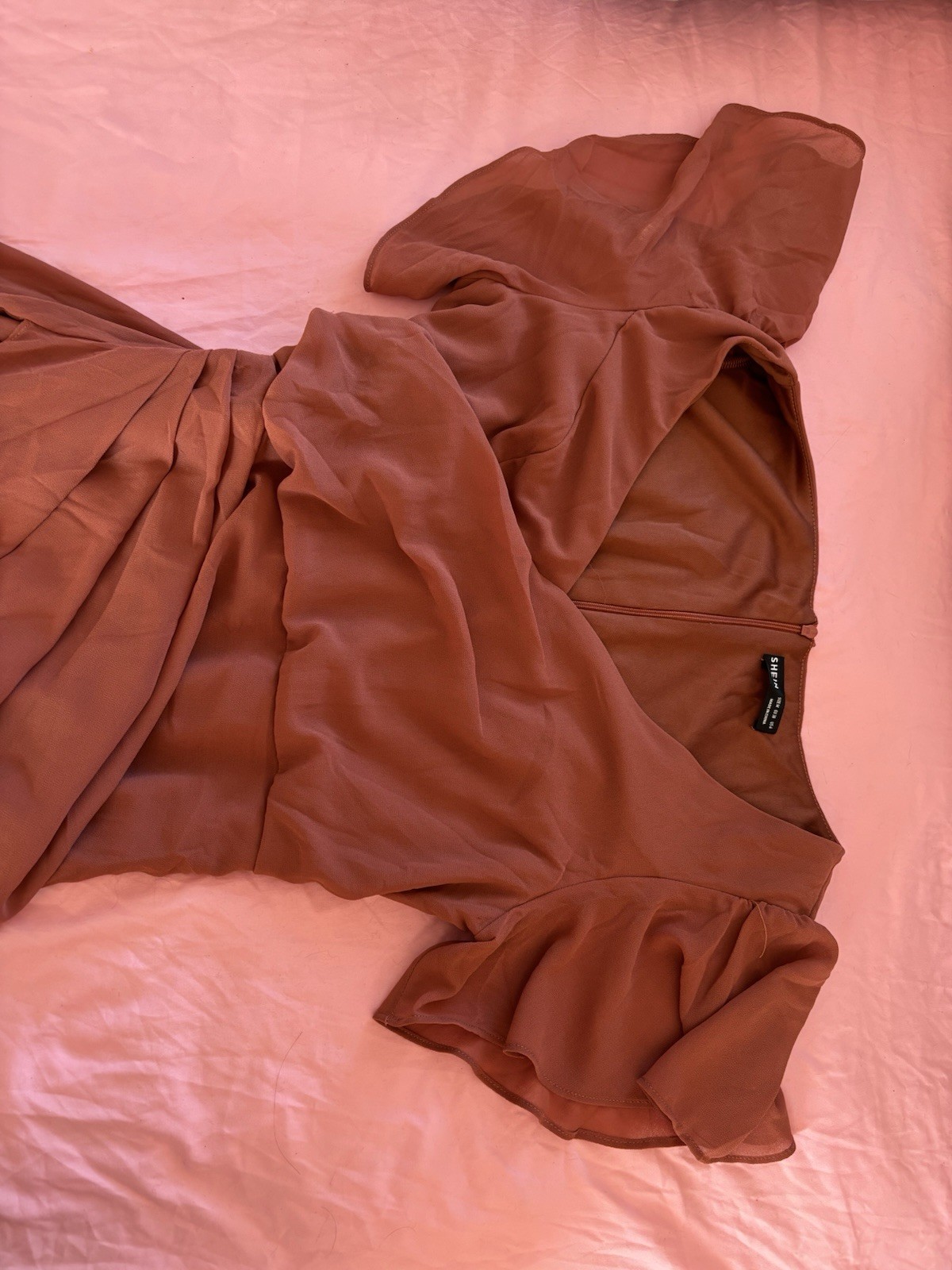 Rust-colored maxi dress with flowy overlay for weddings or fall events.