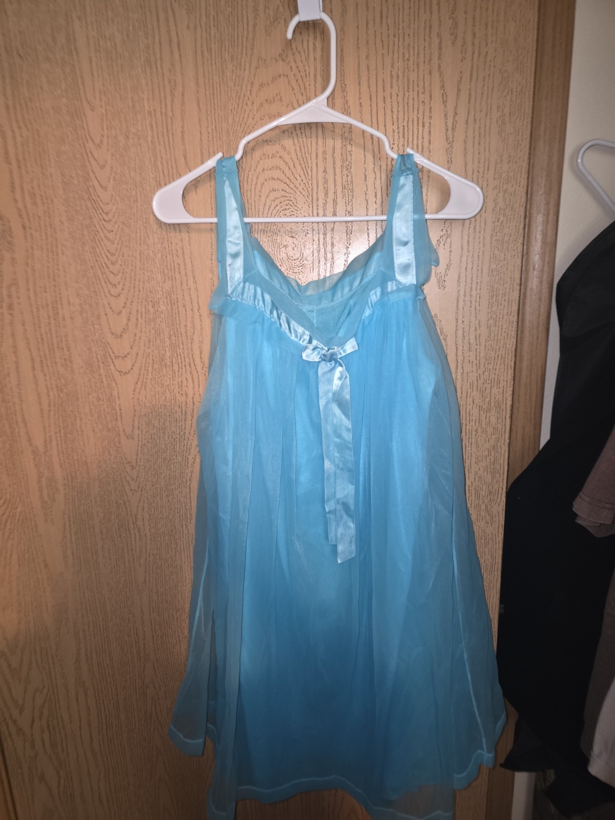 1960’s vintage sheer chiffon babydoll nightgown in a vibrant turquoise blue.