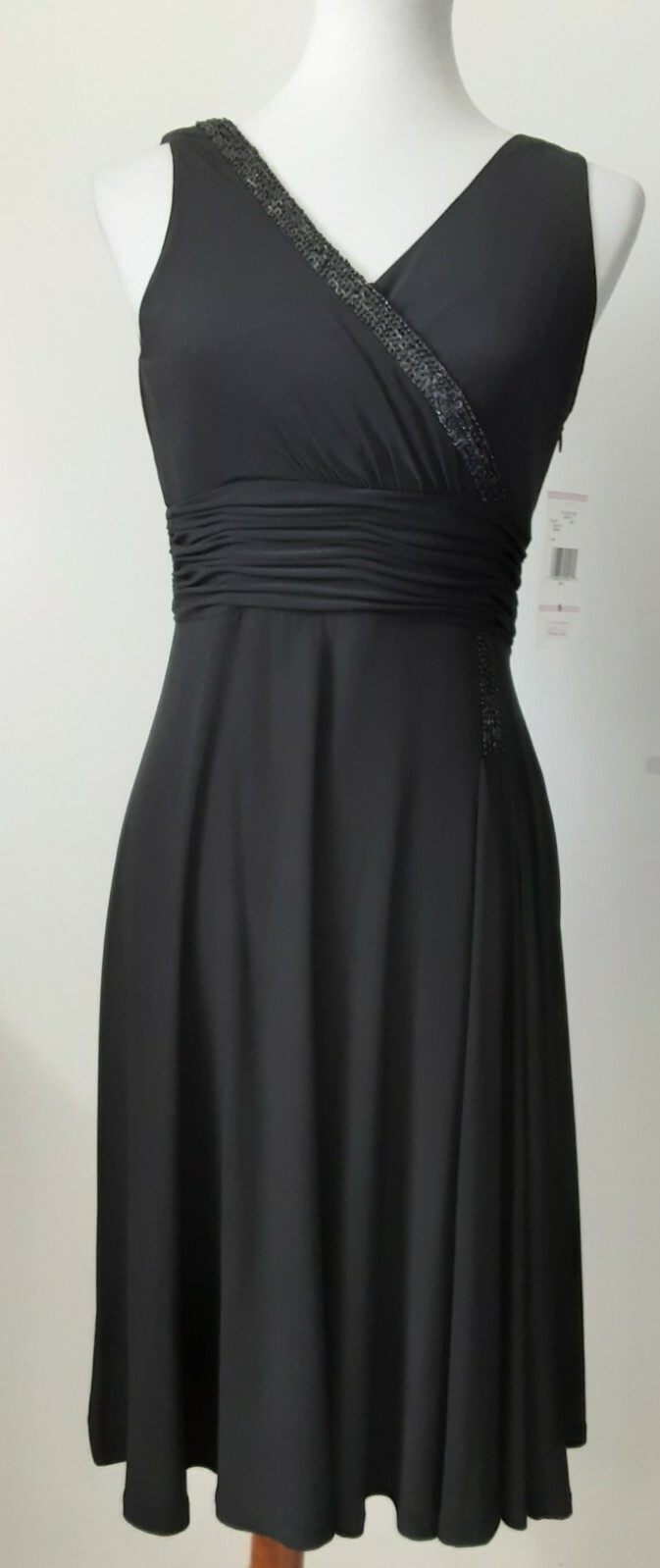 EVAN PICONE BLACK CROSS OVER V NECK DRESS. SIZE 6