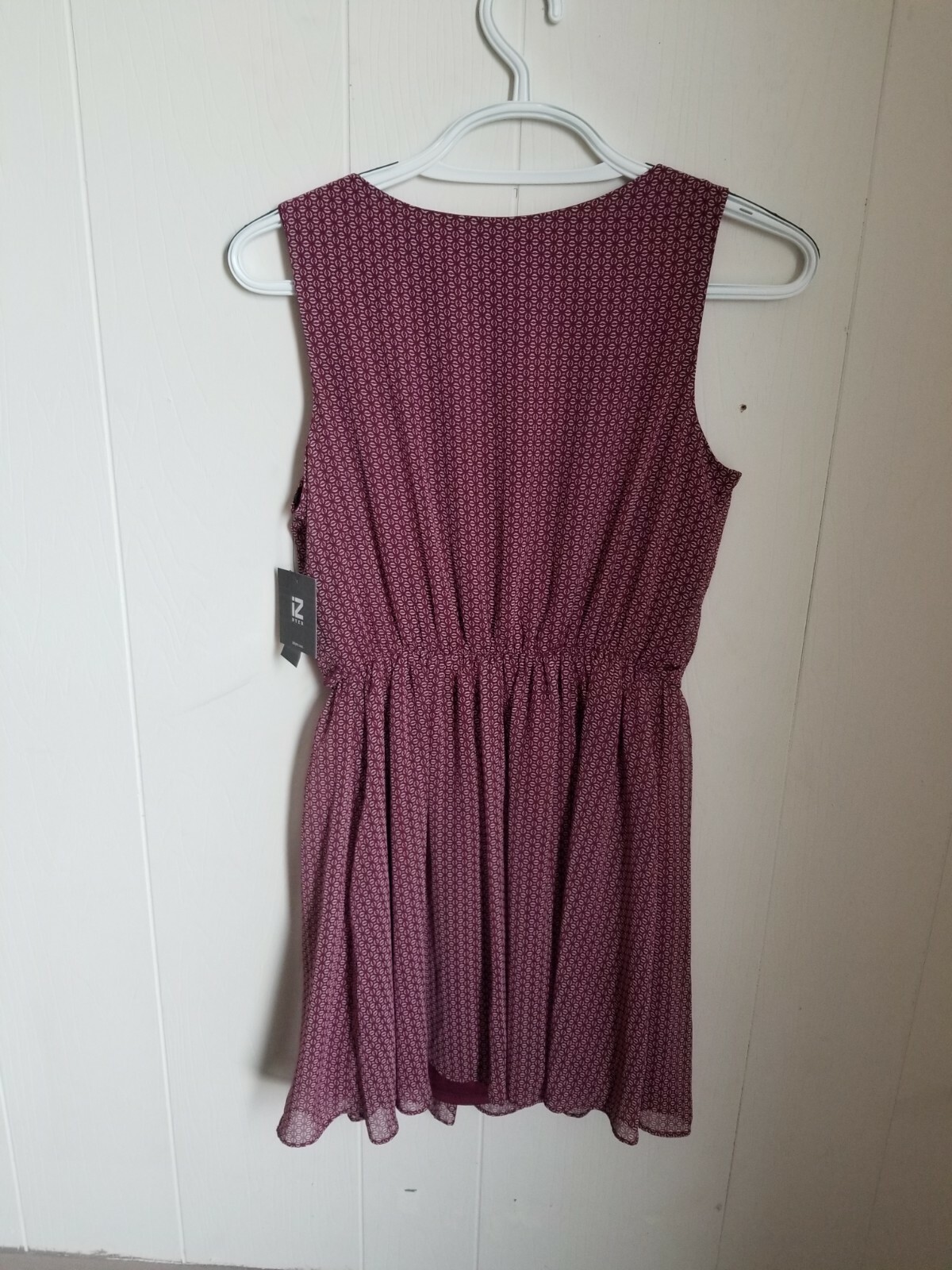NEW ,SIZE LARGE IZ BYER DRESS. WINE COLORED POLYESTER.MID THIGH LENGTH.