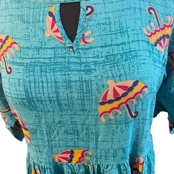 Make an exciting choice for a casual outing with this simple, A-line dress from