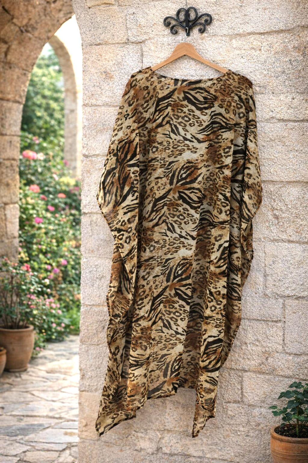 Women Metrostyle sheer animal print top. Size L