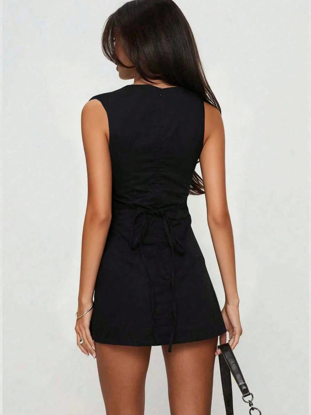 Elegant sleeveless dress with round neckline, backless, tie design, figure
