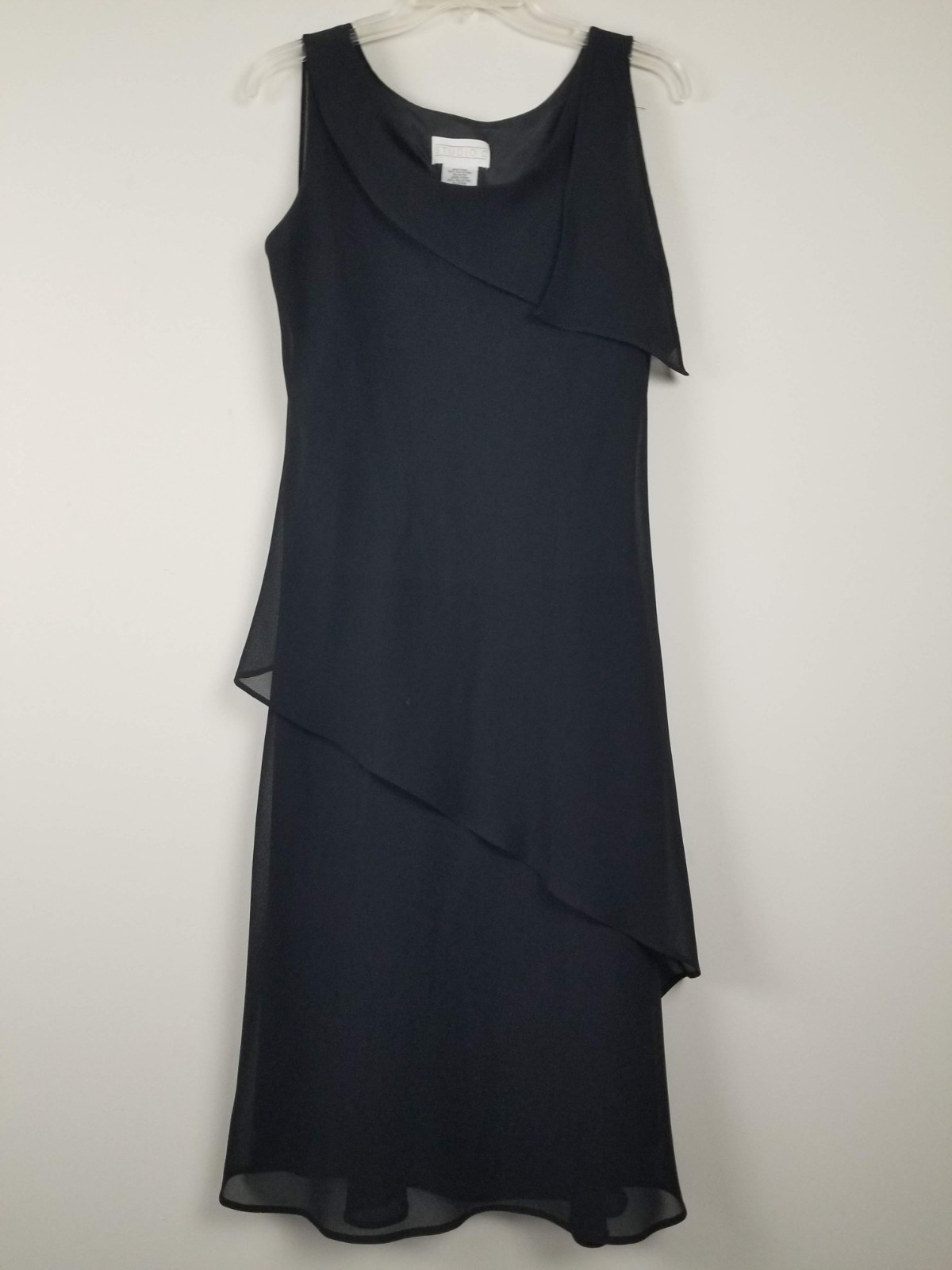 woman’s business or dressy dress with flowing flaps size 10 Black no stretch
