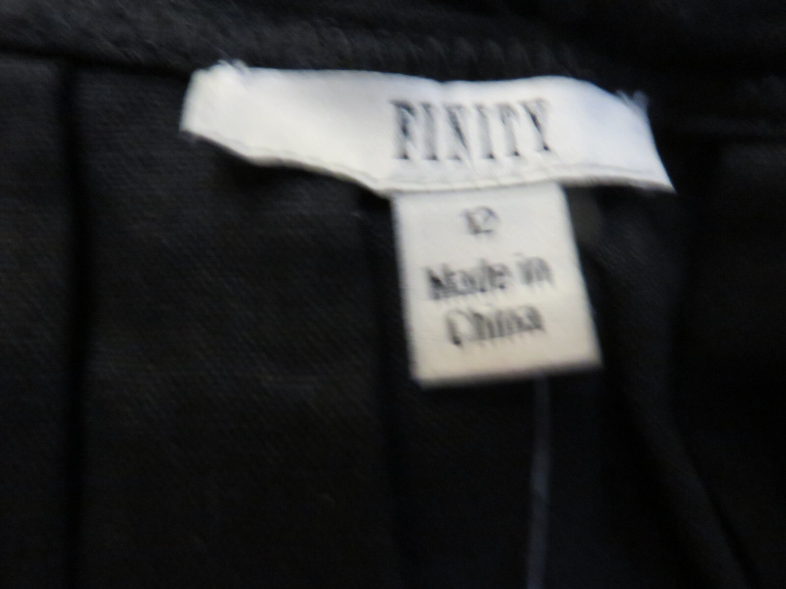Finity Black dress, floor length with scalloped neckline. Size 12, NWT