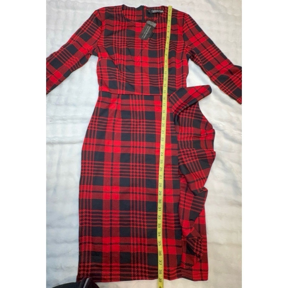 NEW women’s size SMALL red and black dress. See pictures for measurements.