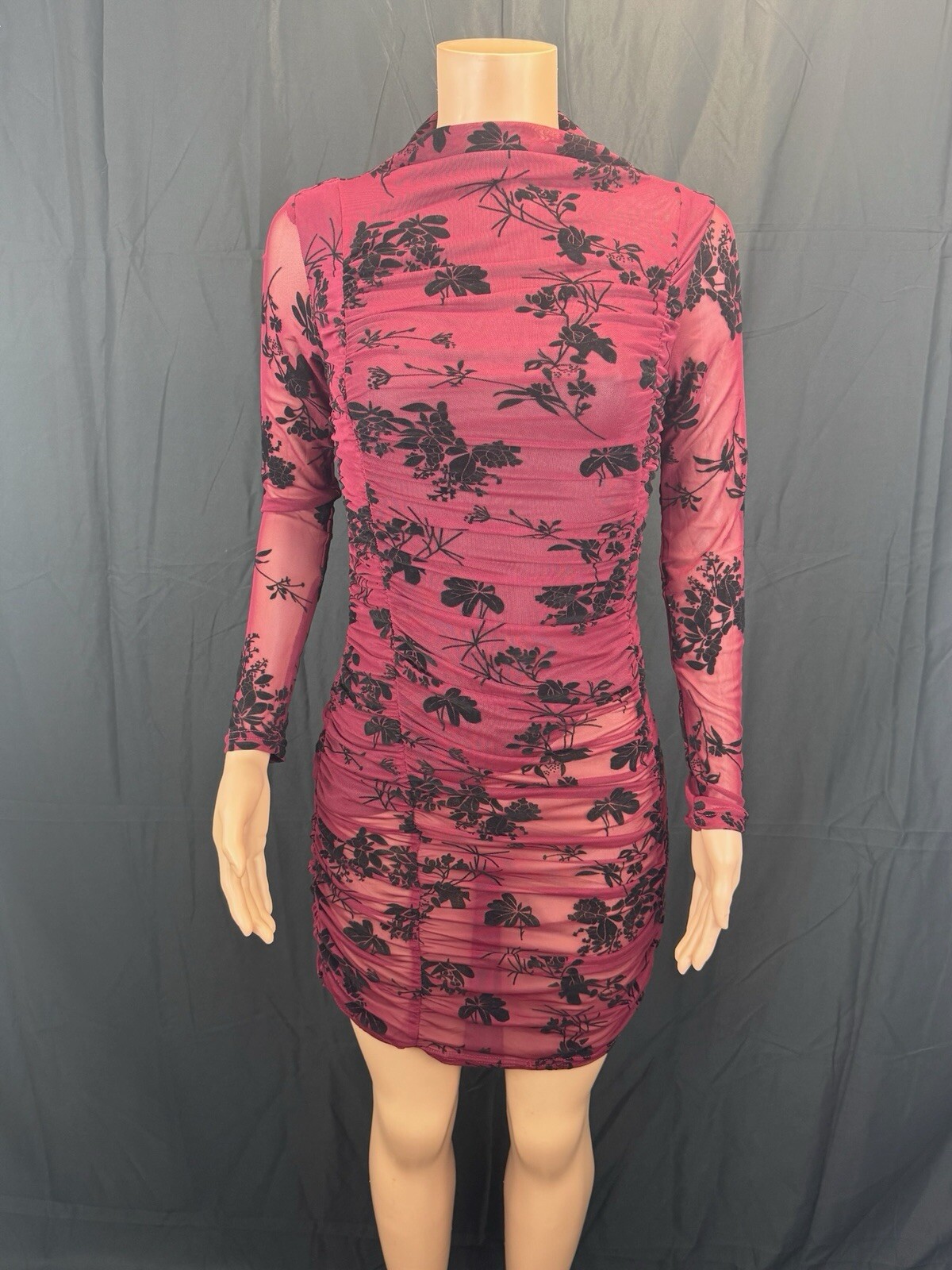 Magenta or Pink Berry Color With Printed Black Floral Designs.