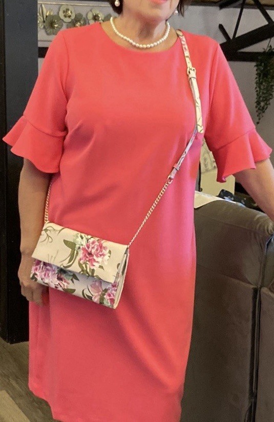 Elegant women’s dress, below-the-knee length, size 14 W. Salmon color.